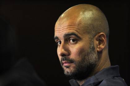 Barcelona's coach Josep Guardiola gives