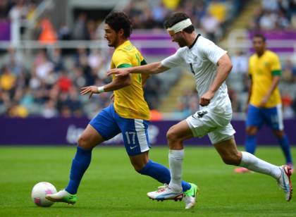 Brazil's forward Alexandre Pato (L) vies