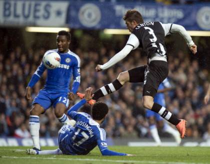 Newcastle United's Davide Santon (R) hit