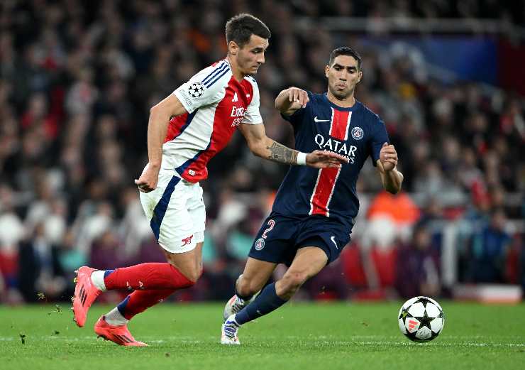 Kiwior e Hakimi in azione durante Arsenal-PSG