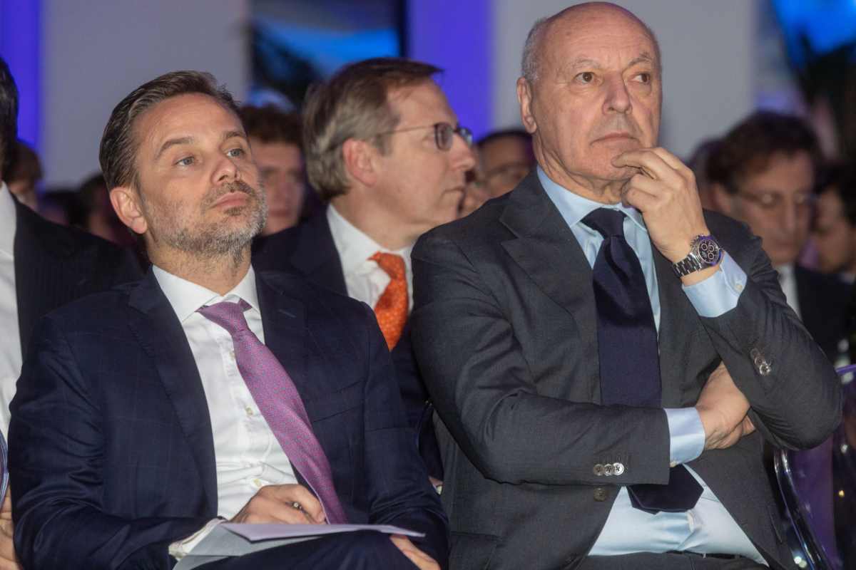 Beppe Marotta dell'Inter e Giorgio Furlani del Milan seduti vicini durante un evento